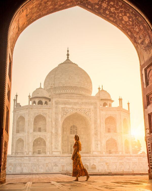 Intrepid Travel india agra taj mahal traveller posing sunset arch scaled